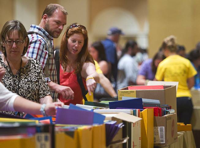 Teachers look over free school supplies during MGM Resorts annual Educator Appreciation Day at the Mirage Thursday Aug. 14, 2014. In addition to school supplies provided by MGM Resort employees, a variety of agencies participated in the days activities to introduce educators to teaching resources available in the community.