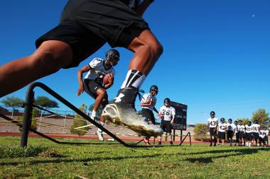 Palo Verde football players run a drill during their first official practice day Thursday, Aug. 14, 2014.