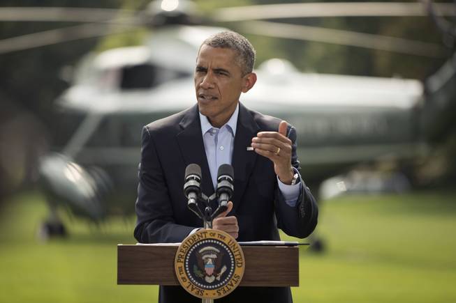 President Barack Obama speaks on the South Lawn of the White House in Washington, Saturday, Aug. 9, 2014, about ongoing situation in Iraq before his departure on Marine One for a vacation in Martha's Vineyard.
