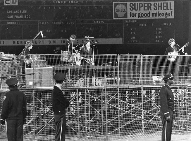 In this photo taken Aug. 29, 1966, The Beatles perform at Candlestick Park in San Francisco. Candlestick Park, known for its bone-numbing winds, the Catch and the earthquake-rocked 1989 World Series, is officially closing after more than a half century of hosting sporting and cultural events. 