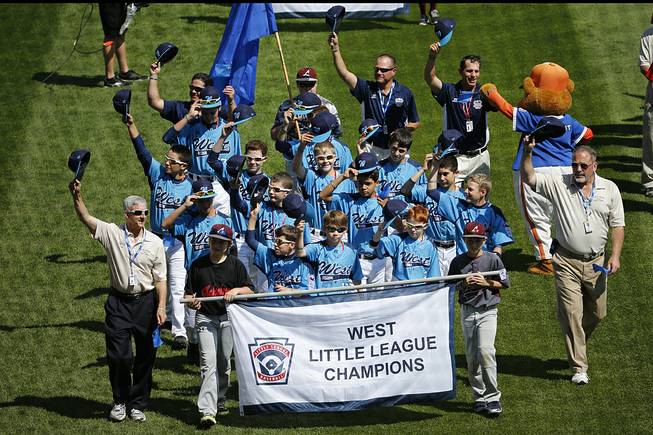 The Mountain Ridge Little League baseball team from Las Vegas participates in the opening ceremony of the 2014 Little League World Series tournament in South Williamsport, Pa., Thursday, Aug. 14, 2014. 