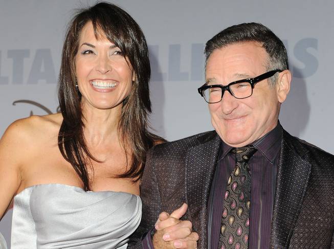 This Nov. 9, 2009, file photo shows actor Robin Williams and his wife, Susan Schneider, at the premiere of "Old Dogs" in Los Angeles.