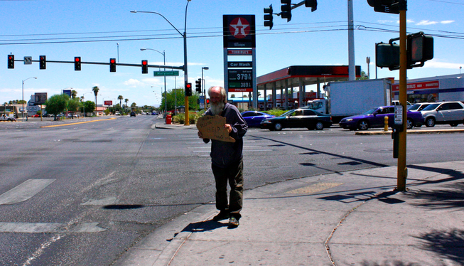 Paul, who says he doesn't have a last name, stands near Maryland Parkway and Tropicana Avenue on Friday, July 25, 2014, in Las Vegas.