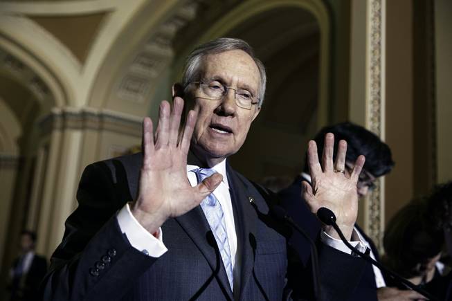 Senate Majority Leader Harry Reid speaks to reporters on Capitol Hill in Washington, July 15, 2014. Reid said Monday, Aug. 18, that he won't be spending time — or money — assisting the campaign of Nevada Democratic gubernatorial candidate Bob Goodman.