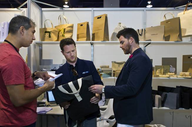 Newly designed bags are shown off at ID Orient LTD during the MAGIC Marketplace Fall Show at the Las Vegas Convention Center on Tuesday, August 19, 2014.  L.E. Baskow