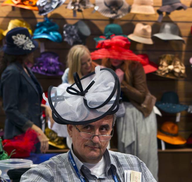 Attendee Peter Kaklamanakis wears a hat from Something Special during the MAGIC Marketplace Fall Show at the Las Vegas Convention Center on Tuesday, August 19, 2014.