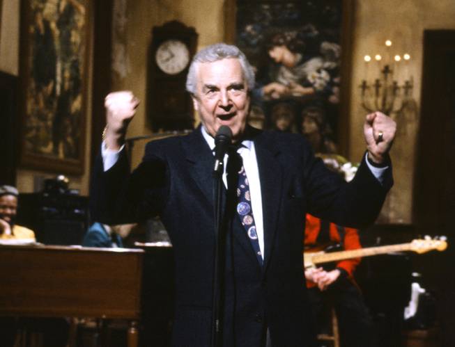 This March 14, 1992, file photo provided by NBC shows announcer Don Pardo on the set of "Saturday Night Live." Pardo, the durable TV and radio announcer whose resonant voiceover style was widely imitated and became the standard in the field, died Monday, Aug. 18, 2014, in Arizona. He was 96.