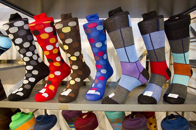 Colorful dress socks for men are shown at the Garment Group booth during the Modern Assembly fashion trade show at the Sands Expo & Convention Center Wednesday, Aug. 20, 2014. The style at right has been a top seller, said director Shawn Razi. The show is a collection of six shows: The Accessories Show, Agenda, Capsule, Liberty, Mrket, and Stitch.