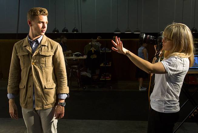 Chase Richardson, a sales manager with Boglioli men's wear, takes direction from South African photographer Kristin Lee Moolman during photo shoot at the Modern Assembly show in the Sands Expo & Convention Center Wednesday, Aug. 20, 2014. The show is a collection of six shows: The Accessories Show, Agenda, Capsule, Liberty, Mrket, and Stitch.