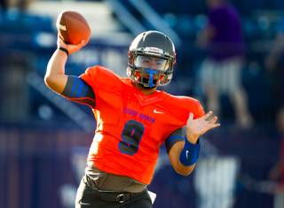 Bishop Gorman QB Danny Hong #9 fires a pass downfield during their game against Brophy Prep on Friday, August 22, 2014.