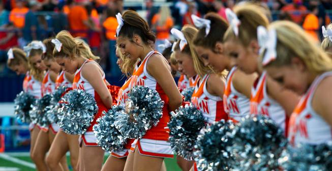 Bishop Gorman cheerleaders perform for the crowd before the start of the game against Brophy Prep on Friday, August 22, 2014.