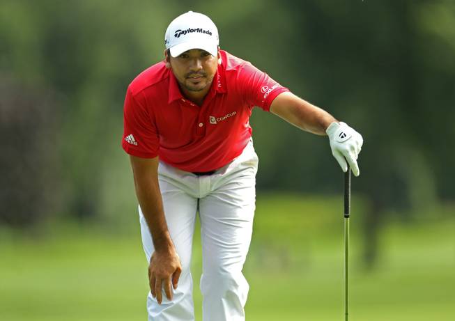 Jason Day, of Australia, lines up his shot on the 14th hole during third round play at the Barclays golf tournament Saturday, Aug. 23, 2014, in Paramus, N.J. (AP Photo/