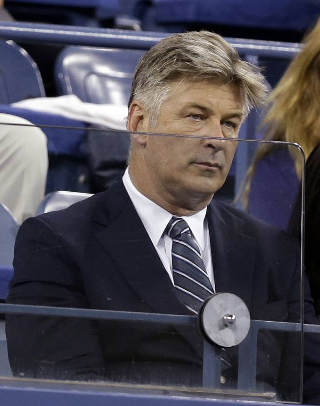 Alec Baldwin watches the match between Maria Sharapova, of Russia, and Maria Kirilenko, of Russia, during the opening round of the U.S. Open tennis tournament Monday, Aug. 25, 2014, in New York. 