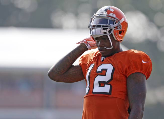 In this Aug. 4, 2014, photo, Cleveland Browns wide receiver Josh Gordon rests during practice at the NFL team's training camp in Berea, Ohio. Gordon has been suspended by the NFL one year for violating the league's substance abuse policy. Gordon's suspension is effective immediately, and he will miss the entire 2014 season.
