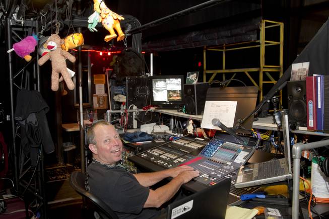 Monitor engineer Cameron Grant is shown at his station before a performance of "Rock Of Ages" at the Venetian Wednesday, Aug. 27, 2014. 