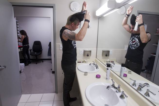 Guitarist Andy Gerold prepares for a performance of "Rock Of Ages" at the Venetian Wednesday, Aug. 27, 2014. 
