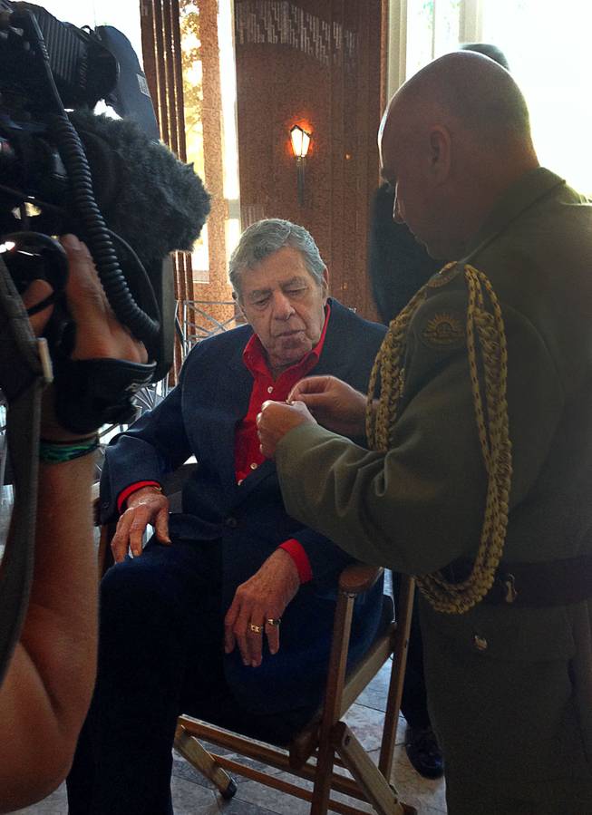 Jerry Lewis is shown his Member of the Order of Australia medal, the highest civilian honor awarded by that country,  at the Smith Center for the Performing Arts on Friday, Aug. 29, 2014. Lewis was recognized for his work with the Muscular Dystrophy Foundation of Australia.