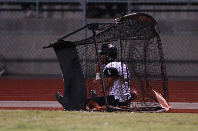 Palo Verde's Darrion Finn sits in a kicking net after being knocked out of bounds during their game against Centennial Friday, Aug. 29, 2014 at Centennial.