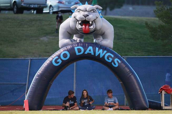 Centennial students sit under their inflatable tunnel as their team takes on Palo Verde Friday, Aug. 29, 2014 at Centennial.