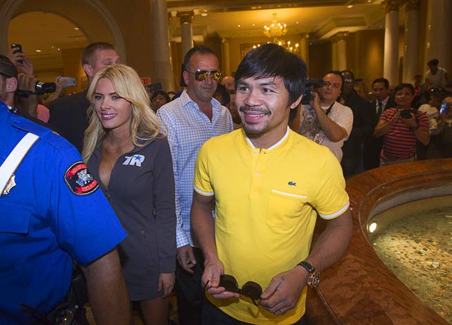 Boxer Manny Pacquiao of the Philippines arrives at the Venetian Saturday, Aug. 30, 2014. Pacquiao and his opponent and Chris Algieri of Huntington, N.Y. are on day six of an international tour promoting their WBO welterweight title fight in Macau, China on November 22, 2014.