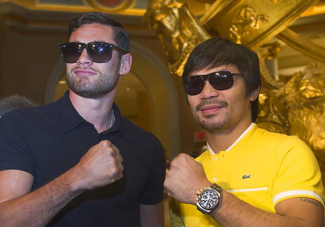 Boxers Chris Algieri, left, of Huntington, N.Y. and Manny Pacquiao of the Philippines pose in the lobby of the Venetian Saturday, Aug. 30, 2014. The boxers are on day six of an international tour promoting their WBO welterweight title fight in Macau, China on November 22, 2014.
