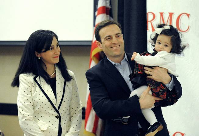 This Jan. 14, 2013, photo shows attorney Adam Laxalt introducing his wife, Jaime, and their daughter, Sophia, at the Republican Men's Club luncheon at the Atlantis Resort-Reno.