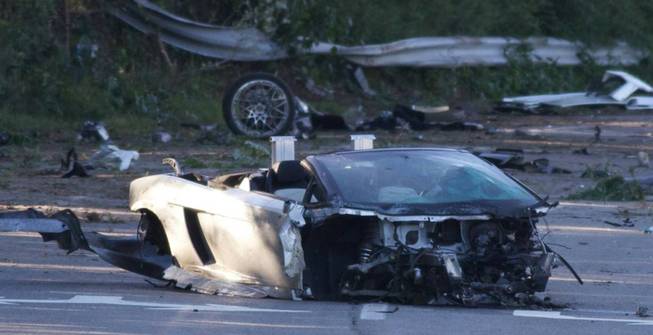 This still image taken from video shows the scene of an early morning crash in Mount Sinai, N.Y., Friday, Aug. 29, 2014. Police say 18-year-old Samuel Shepard was taking the car for a spin on a county road in Mount Sinai on Long Island early Friday when he lost control.