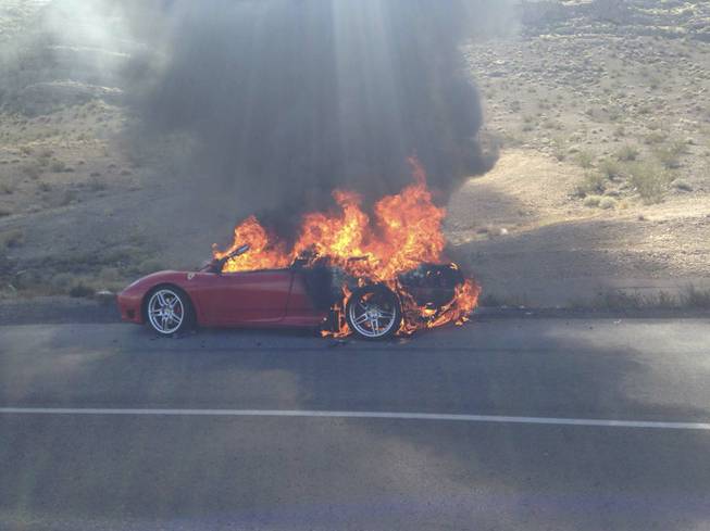 A 2004 Ferrari Spider is engulfed in flames on northbound Interstate 15 near the Valley of Fire. The two passengers in the car, who were traveling back to Utah after a weekend in Las Vegas, were not injured, but the car was a total loss.