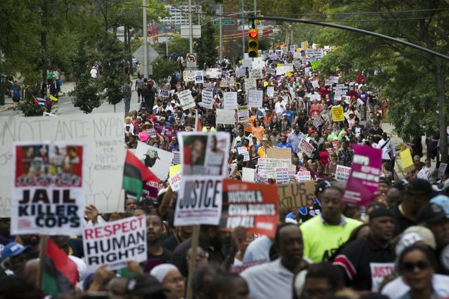 Demonstrators march to protest the death of Eric Garner in the Staten Island borough of New York. The city medical examiner ruled that Garner, 43, died as a result of a police chokehold during an attempted arrest. 