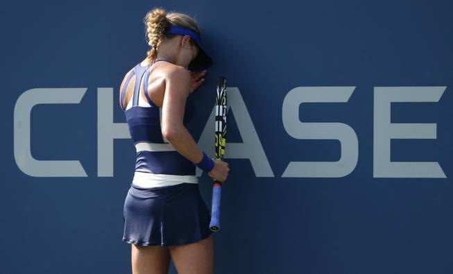 Eugenie Bouchard, of Canada, reacts after a shot against Ekaterina Makarova, of Russia, during the fourth round of the 2014 U.S. Open tennis tournament, Monday, Sept. 1, 2014, in New York. 