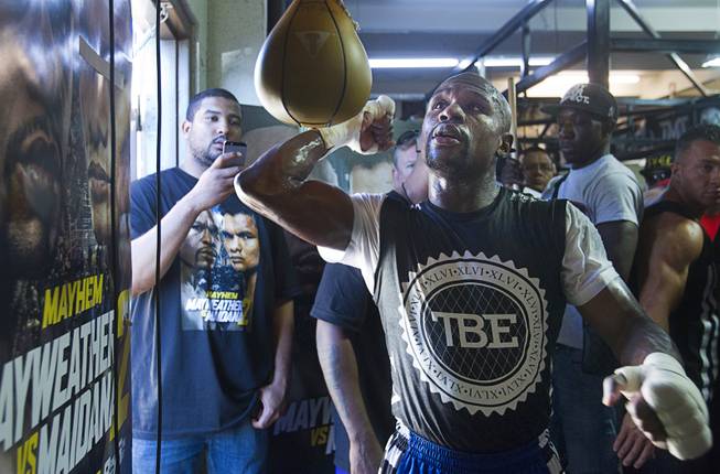 WBC/WBA welterweight champion Floyd Mayweather Jr. hits a speedbag during a media day at the Mayweather Boxing Club Tuesday, Sept. 2, 2014. Mayweather will face Marcos Maidana of Argentina in a rematch at the MGM Grand Garden Arena on Saturday, Sept. 13.