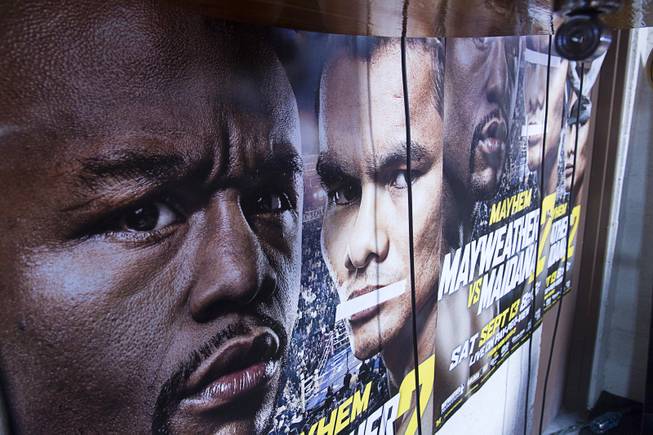 Images of WBC/WBA welterweight champion Floyd Mayweather Jr. and Marcos Maidana are seen on a poster at the Mayweather Boxing Club Tuesday, Sept. 2, 2014. Tape covers Maidana;s mouth because, "he talks too much," said cutman Rafael Garcia. Mayweather will face Marcos Maidana of Argentina in a rematch at the MGM Grand Garden Arena on Saturday, Sept. 13.