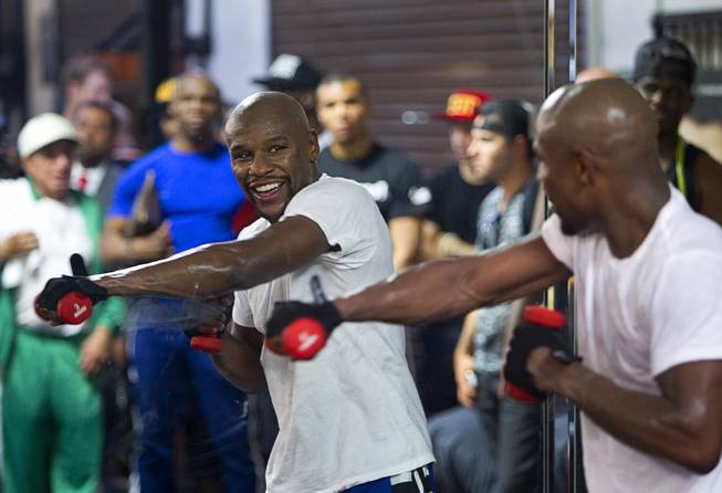 WBC/WBA welterweight champion Floyd Mayweather Jr. works out in front of a mirror during a media day at the Mayweather Boxing Club Tuesday, Sept. 2, 2014. Mayweather will face Marcos Maidana of Argentina in a rematch at the MGM Grand Garden Arena on Saturday, Sept. 13.