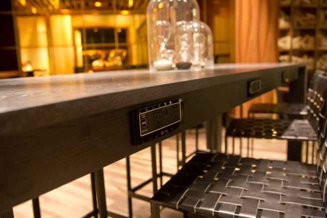 A/C power plug and USB power outlets are embedded along tabletops at 3940 Coffee + Tea at the new Delano Las Vegas on Tuesday, Sept. 2, 2014.