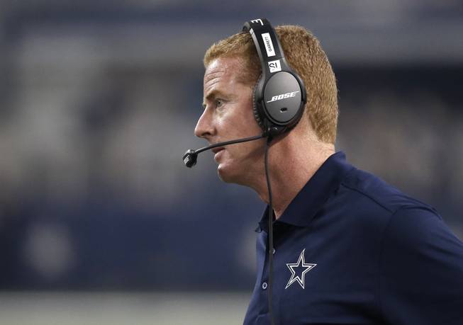 Dallas Cowboys head coach Jason Garrett watches the game from the sidelines in the first half of a NFL preseason football game against the Denver Broncos, Thursday, Aug. 28. 2014, in Arlington, Texas.