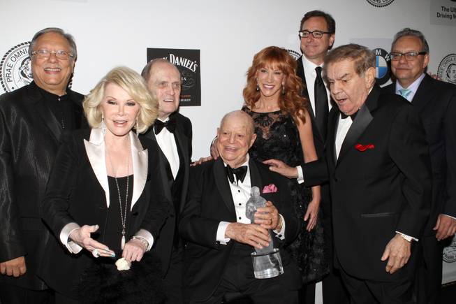 Musician Arturo Sandoval, left, Comedian Joan Rivers, Comedian Bob Newhart, Honoree Don RIckles, Comedian Kathy Griffin, Actor Bob Saget, Friars Clubs Dean Freddie Roman and Comedian Lewis Black pose for photos at the Friars Club Roast in his honor at the Waldorf Astoria on Monday, June 24, 2013 in New York. 