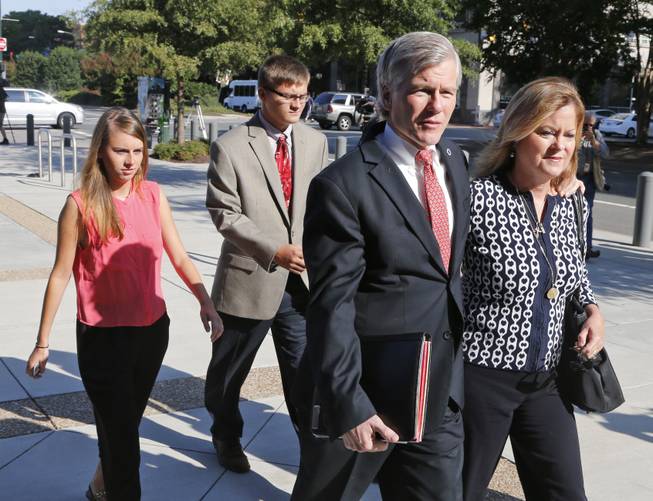 Former Virginia Gov. Bob McDonnell, second left, talks to his sister Eileen Reinamanas they arrive at federal court for the third day of jury deliberations in his corruption trial in Richmond, Va., Thursday, Sept. 4, 2014. McDonnell and his wife Maureen are charged in a 14-count indictment with doing special favors for Jonnie Williams, the CEO of dietary supplements maker Star Scientific Inc., in exchange for $165,000 in gifts and loans. 