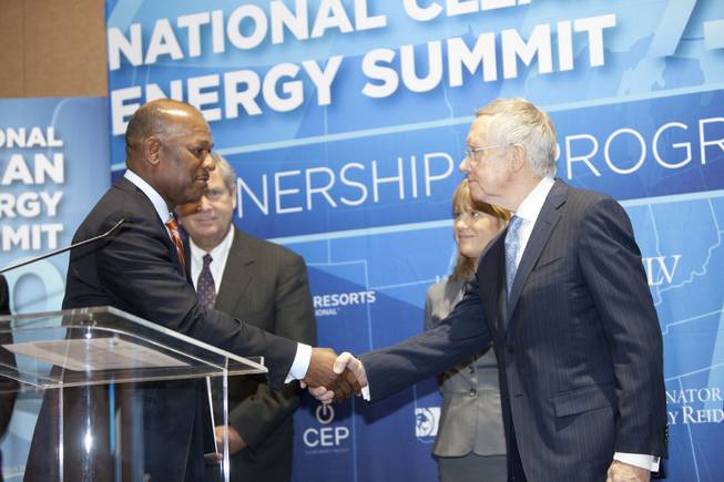 Myron Gray, president of U.S. operation for UPS shakes Senate Majority Leader Harry Reid's hand during a press conference announcing the Fulcrum BioEnergy Inc. Sierra BioFuels project during the the “National Clean Energy Summit 7.0: Partnership & Progress” on Thursday, September 4th at Mandalay Bay Resort & Casino in Las Vegas.