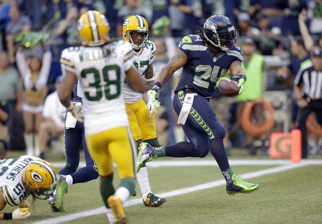 Seattle Seahawks running back Marshawn Lynch scores a touchdown in the first half against the Green Bay Packers on Thursday, Sept. 4, 2014, in Seattle.