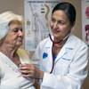 (From right) Dr. Florence Jameson, a veteran OB/GYN in town, checks on patient Maria Sosa-Cuellar at the Volunteers in Medicine on Wednesday, September 3, 2014.  Jameson is is also the volunteer CEO there which opened its first clinic a few years ago to serve uninsured patients. 