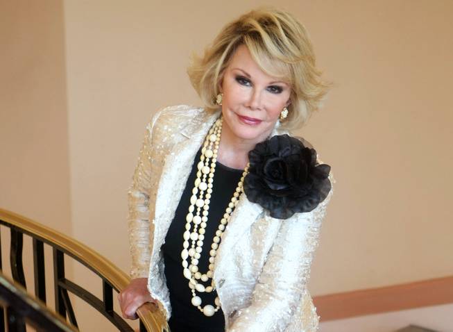 This Oct. 5, 2009, file photo shows Joan Rivers as she presents "Comedy Roast With Joan Rivers " during the 25th MIPCOM (International Film and Programme Market for TV, Video, Cable and Satellite) in Cannes, France. Rivers died Thursday, Sept. 4, 2014. She was 81. Rivers was hospitalized Aug. 28 after going into cardiac arrest at a doctor's office. 