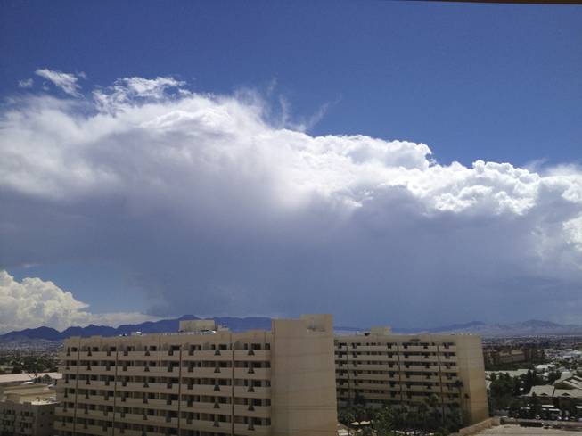 Storm clouds rise above the southern Las Vegas Valley on Sunday, Sept. 7, 2014. The building in the foreground is the Cancun Resort, 8335 Las Vegas Blvd. South.