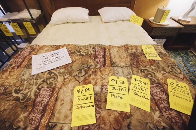 Bedspreads, pillows and sheets are available for purchase at a liquidation sale in the Clarion on Wednesday, Sept. 10, 2014, in Las Vegas.