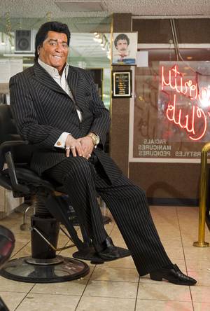 Neil Scartozzi poses at his Celebrity Club Barber Salon at the Riviera Monday Sept. 15, 2014.