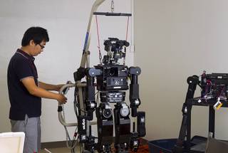 Research assistant Kiwon Sohn works on the DRC-Hubo robot at UNLV Wednesday Sept. 24, 2014. The research assistant followed UNLV professor Paul Oh, who came from Drexel University for UNLV's drones/robotics program.