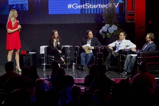 Rebecca Zajac, left, of Design by Numbers, listens to a judge's question during a  "Get Started Las Vegas" event at the Palms' Rain nightclub Thursday Sept. 25, 2014. Cox Business sponsored the "Shark Tank"-style event where a handful of start-ups and business owners competed for a $15,000 prize package.