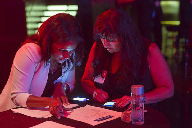 Scores are tabulated during a "Get Started Las Vegas" event at the Palms' Rain nightclub Thursday Sept. 25, 2014. Cox Business sponsored the "Shark Tank"-style event where a handful of start-ups and business owners competed for a $15,000 prize package.