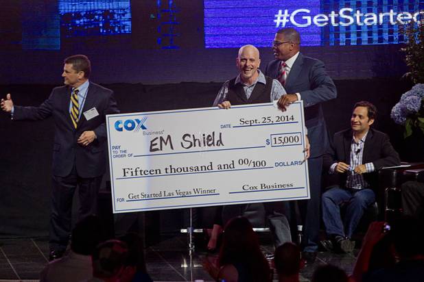 R. Blank of EM Shield poses with an oversized check after winning the Get Started Las Vegas event at the Palms' Rain nightclub Thursday, Sept. 25, 2014. Cox Business sponsored the "Shark Tank"-style event where a handful of startups and business owners competed for a $15,000 prize package.