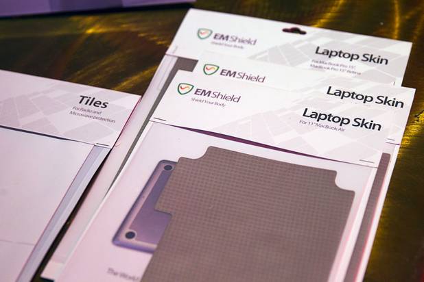 Laptop skins are displayed at the EM Shield booth during a "Get Started Las Vegas" event at the Palms' Rain nightclub Thursday Sept. 25, 2014. The shields protect consumers from wireless radiation. Cox Business sponsored the "Shark Tank"-style event where a handful of start-ups and business owners competed for a $15,000 prize package.