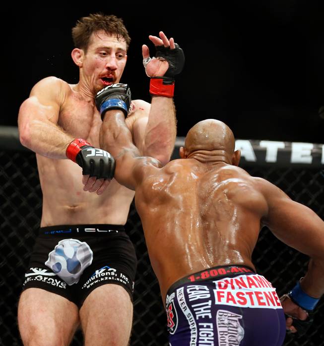 Middleweight fighter Tim Kennedy takes a punch to the face from opponent Yoel Romero during UFC 178 at the MGM Grand Garden Arena on Saturday, September 27, 2014.